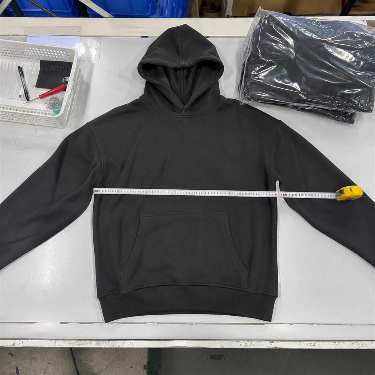 Garment measurement and workmanship review for custom streetwear quality control
